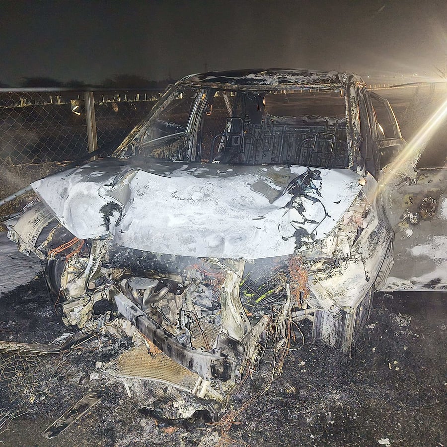 <div class="paragraphs"><p>Mangled remains of the car that caught fire on NH-48 on the outskirts of Davangere in the wee hours of Thursday.</p></div>
