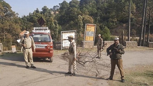 <div class="paragraphs"><p>Police personnel stand guard after security forces established contact with three terrorists during a search operation in a village in Ramnagar, Udhampur.&nbsp;</p></div>