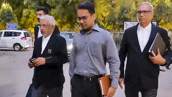 <div class="paragraphs"><p>Senior advocate Dayan Krishnan and special public prosecutor Narender Mann, who are representing the NIA, with others arrive at the Patiala House Court, in New Delhi.</p></div>