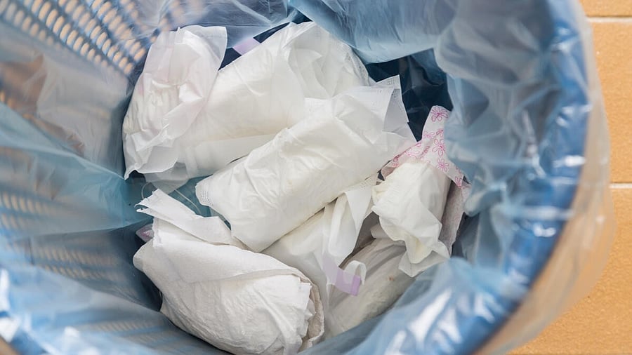 <div class="paragraphs"><p>Closeup used sanitary napkin pad wrapped disposed in rubbish bin</p></div>