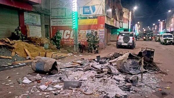 <div class="paragraphs"><p>Security personnel keep a vigil at an area amid protests over the Waqf (Amendment) Act, in Murshidabad district. </p></div>