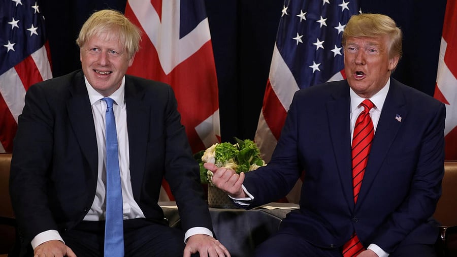 <div class="paragraphs"><p>Boris Johnson whose government ratified Brexit (L) with Donald Trump (R)</p></div>