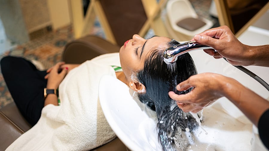 <div class="paragraphs"><p>A young woman getting her hair washed at a professional hairdresser. For representational purposes.</p></div>