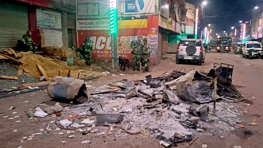<div class="paragraphs"><p>Security personnel keep a vigil at an area amid protests over the Waqf (Amendment) Act, in Murshidabad district, West Bengal, Saturday, April 12, 2025. </p></div>