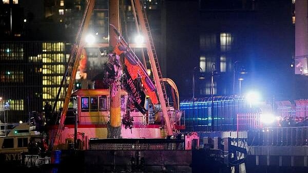 <div class="paragraphs"><p>Emergency personnel work at the scene of a helicopter crash on the Hudson River near lower Manhattan in New York.</p></div>