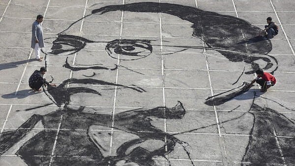 <div class="paragraphs"><p>Students make a large portrait of Dr BR Ambedkar with charcoal at a school on the eve of ‘Ambedkar Jayanti’, in Moradabad, Uttar Pradesh, Sunday.&nbsp;</p></div>