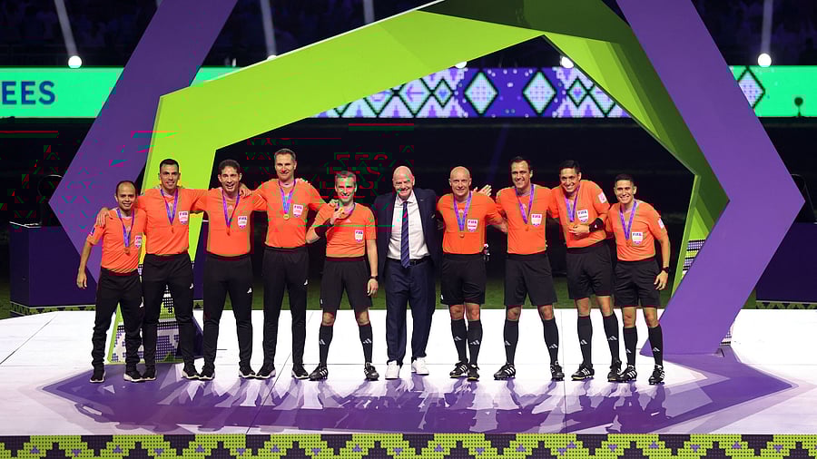 <div class="paragraphs"><p> FIFA president Gianni Infantino poses with referees during the trophy ceremony after the Club World Cup final. File Photo</p></div>