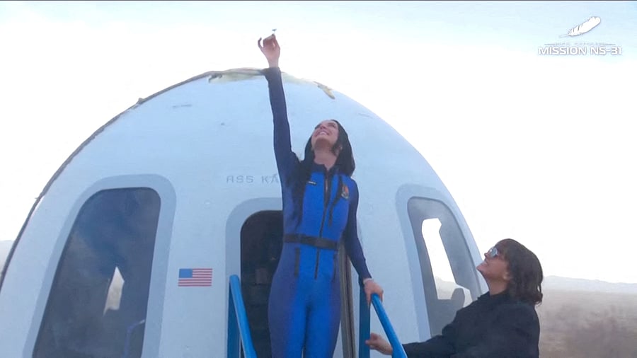 <div class="paragraphs"><p>Pop star Katy Perry comes out of the capsule in which she, journalists Gayle King, Lauren Sanchez, who is also billionaire Jeff Bezos' fiance and other participants, landed back on earth after blasting off into space on a Blue Origin rocket, as part of the New Shepard Mission NS-31, marking the first all-female flight crew in more than six decades, in West Texas, Texas, US, April 14, 2025, in this screen grab taken from a video. </p></div>