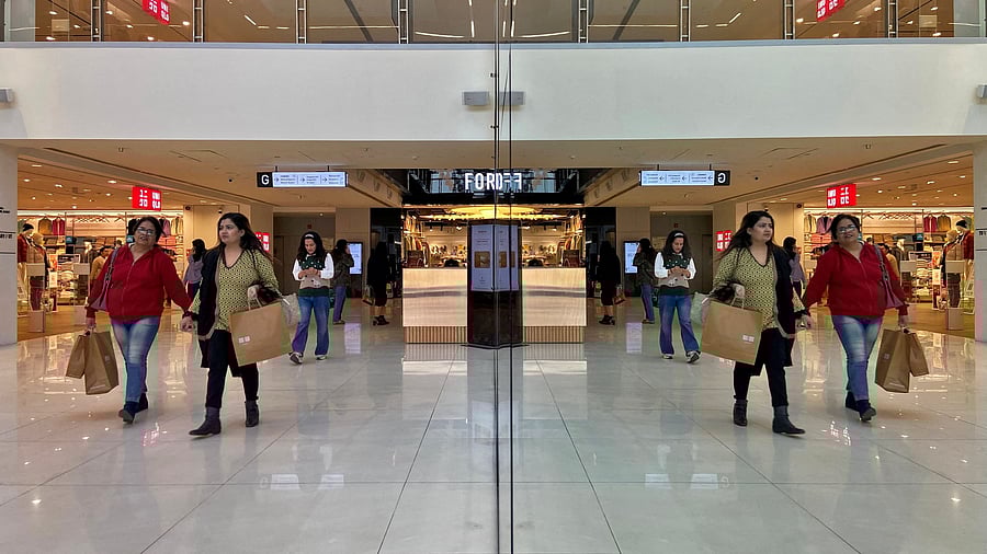 <div class="paragraphs"><p>FILE PHOTO: Shoppers are reflected in mirror inside a shopping mall in New Delhi, India.</p></div>
