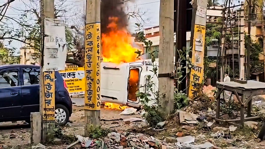 <div class="paragraphs"><p>Flames billow out after a vehicle was set on fire during a protest over the Waqf (Amendment) Act, in Murshidabad district of West Bengal, Tuesday, April 8, 2025.</p></div>
