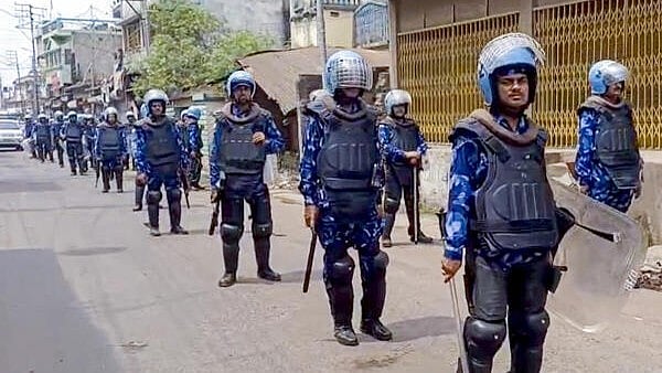 <div class="paragraphs"><p>Security personnel stand guard in a violence-affected area, in Murshidabad district, West Bengal on Monday</p></div>