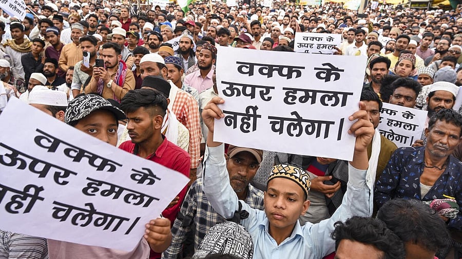 <div class="paragraphs"><p>People hold placards during a protest against the Waqf (Amendment) Act, in Jabalpur.</p></div>