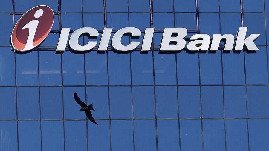 <div class="paragraphs"><p> A bird flies past the facade of the ICICI bank head office in Mumbai</p></div>