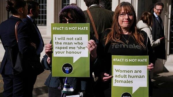 <div class="paragraphs"><p>People await a ruling on an appeal by For Women Scotland outside the Supreme Court in London</p></div>
