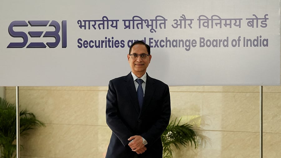 <div class="paragraphs"><p>New chairman of Securities and Exchange Board of India Tuhin Kanta Pandey poses for a photo as he enters the SEBI Bhavan building in Mumbai, India, March 1, 2025. </p></div>