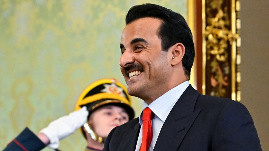 <div class="paragraphs"><p>Qatar's Emir, Sheikh Tamim bin Hamad Al Thani walks past a guard of honour during a meeting with Russia's President Vladimir Putin at the Kremlin in Moscow, Russia, April 17, 2025. </p></div>