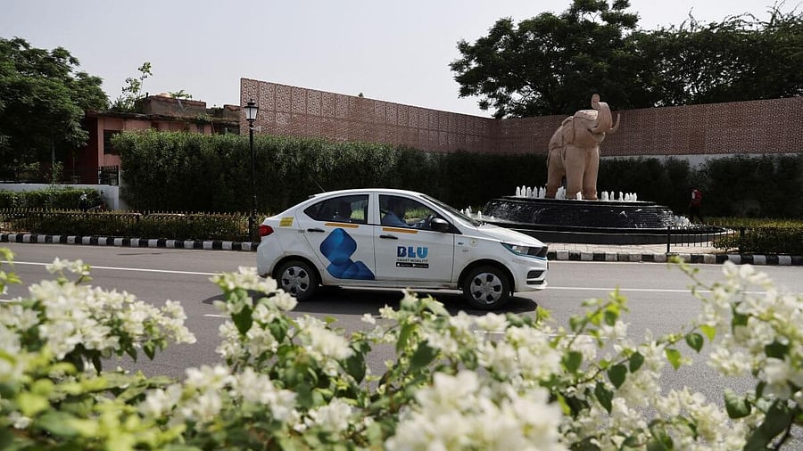 <div class="paragraphs"><p>A man drives a BluSmart electric car on a road in New Delhi.</p></div>