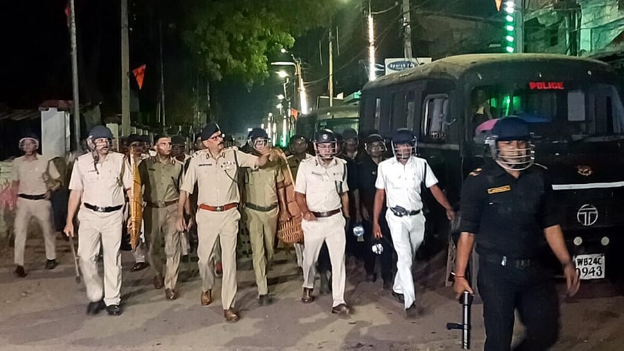 <div class="paragraphs"><p>Police and security personnel keep a vigil at an area amid protests over the Waqf (Amendment) Act, in Murshidabad</p></div>