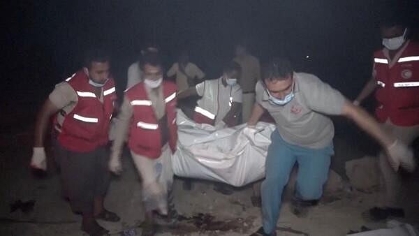 <div class="paragraphs"><p>Red Crescent personnel move the body of a victim following, what Al Masirah TV said, was a U.S. strike on the Ras Isa fuel port, Yemen.</p></div>
