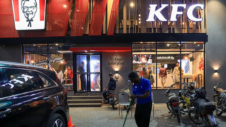 <div class="paragraphs"><p>A worker clears the floor at a KFC fast food outlet, which was attacked and vandalised during an anti-Israel protest last week, in Karachi, Pakistan.</p></div>