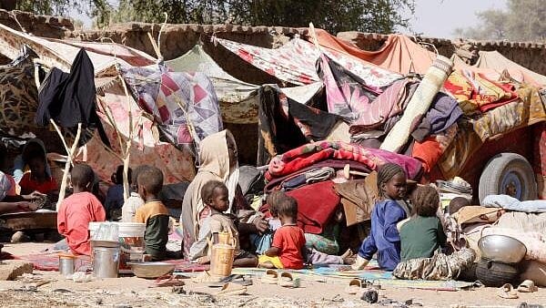 <div class="paragraphs"><p>A displaced Sudanese woman looks on next children, following Rapid Support Forces (RSF) attacks on Zamzam displacement camp, as she shelters in the town of Tawila, North Darfur, Sudan.</p></div>