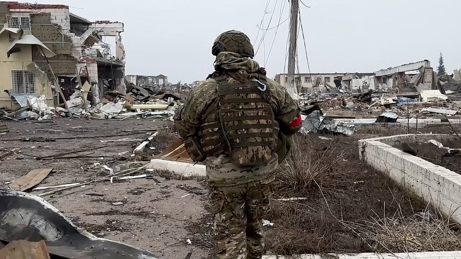 <div class="paragraphs"><p>A Russian army soldier walks along a ruined street of Malaya Loknya settlement, which was recently retaken by Russia's armed forces in the course of Russia-Ukraine conflict in the Kursk region</p></div>