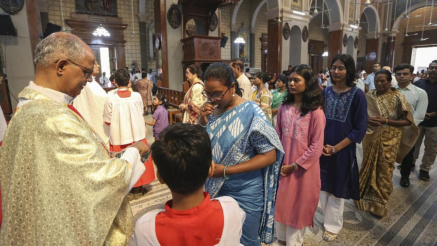 <div class="paragraphs"><p>A priest performs rituals during a mass on Easter Sunday at St. Joseph's Cathedral, in Prayagraj, Sunday, April 20, 2025.</p></div>