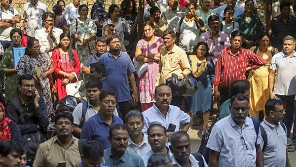 <div class="paragraphs"><p>Relatives wait outside an examination centre during the Common Entrance Test (CET) in Karnataka, in Bengaluru.</p></div>