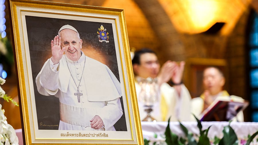 <div class="paragraphs"><p>A picture of Pope Francis is kept on display duing a Mass, after his death was announced by the Vatican,.</p></div>