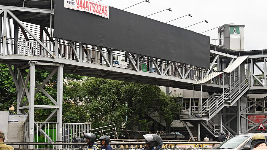 <div class="paragraphs"><p>Advertising billboard on a skywalk at Mysuru Road</p></div>