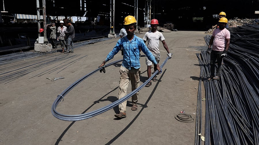 <div class="paragraphs"><p>Labourers load TMT steel bars into a truck for supply inside a steel bar manufacturing factory at Viramgam, in Gujarat, India, April 7, 2025. For representational purposes.</p></div>