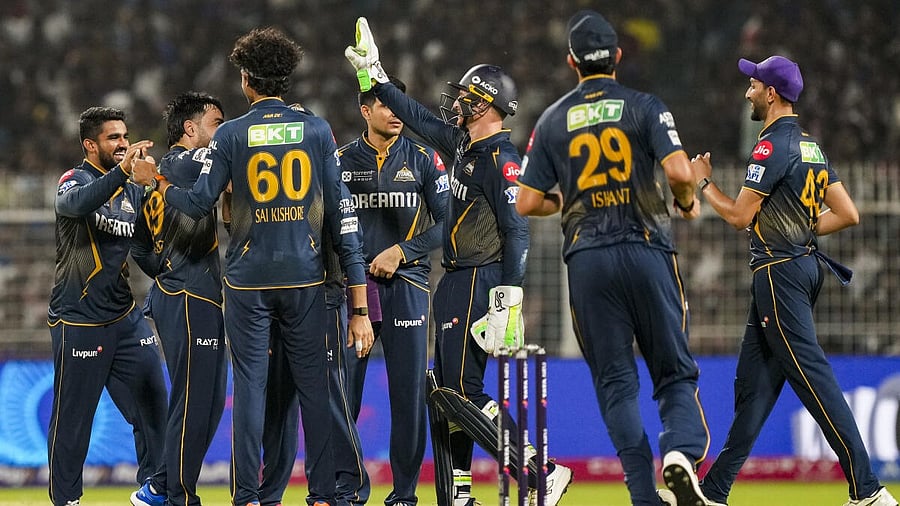 <div class="paragraphs"><p>GT's Rashid Khan with teammates celebrates the wicket of KKR's Sunil Narine during the Indian Premier League (IPL) cricket match between Kolkata Knight Riders and Gujarat Titans</p></div>