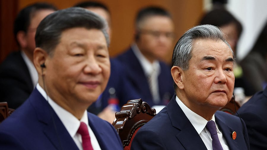 <div class="paragraphs"><p>Chinese President Xi Jinping and Foreign Minister Wang Yi </p></div>