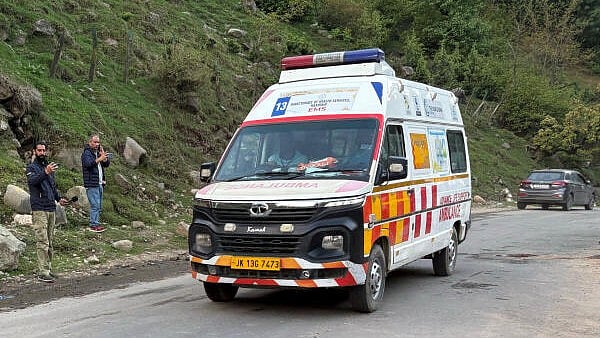 <div class="paragraphs"><p>An ambulance drives following a suspected militant attack, near Pahalgam in south Kashmir's Anantnag district</p></div>