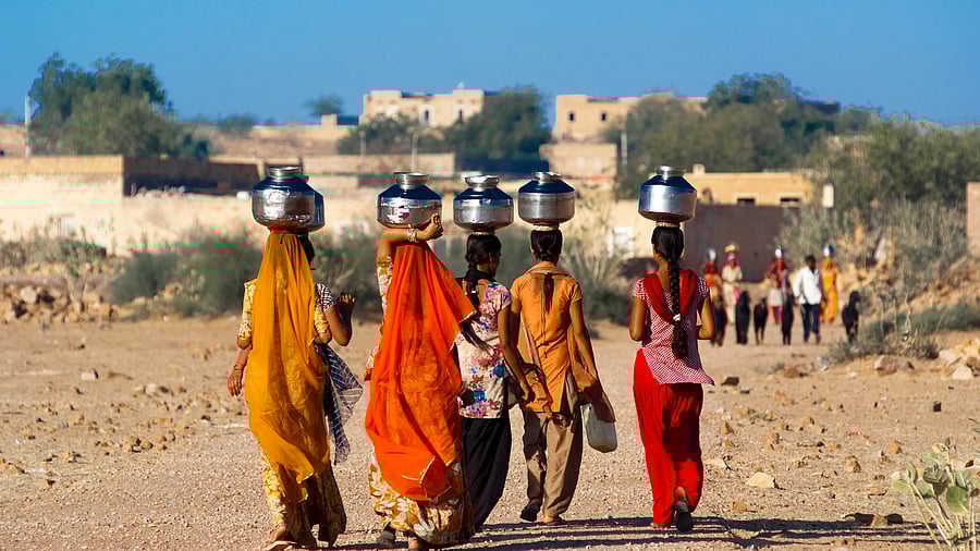 <div class="paragraphs"><p>Women carrying water in the desert state of Rajasthan.</p></div>