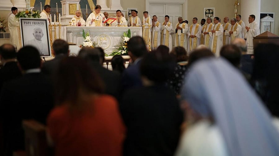 <div class="paragraphs"><p>Clergymen hold a memorial Mass for Pope Francis at the Cathedral of the Good Shepherd in Singapore April 22, 2025.</p></div>