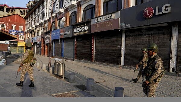 <div class="paragraphs"><p>Security personnel stand guard during a strike call given by traders, transporters and other several organisations against the Pahalgam terror attacks, in Srinagar.</p></div>