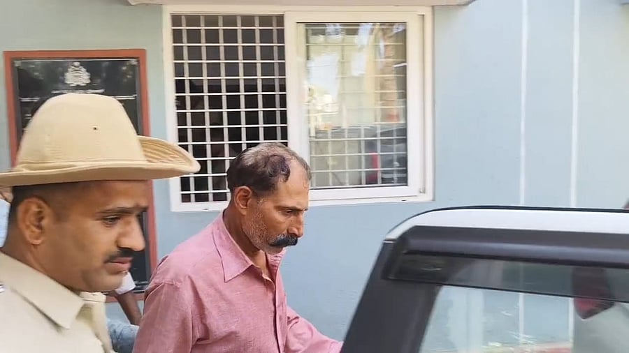 <div class="paragraphs"><p>The suspect, Vittal Monappa, in police custody on Thursday evening. </p></div>