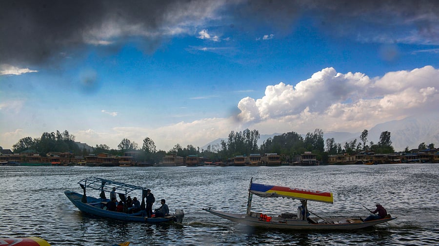<div class="paragraphs"><p>Tourists ride 'Shikara' at the Dal Lake, seen a day after the Pahalgam terror attack, in Srinagar, Wednesday, April 23, 2025. At least 26 people were killed in the terrorist attack in J&amp;K's Pahalgam on Tuesday. </p></div>