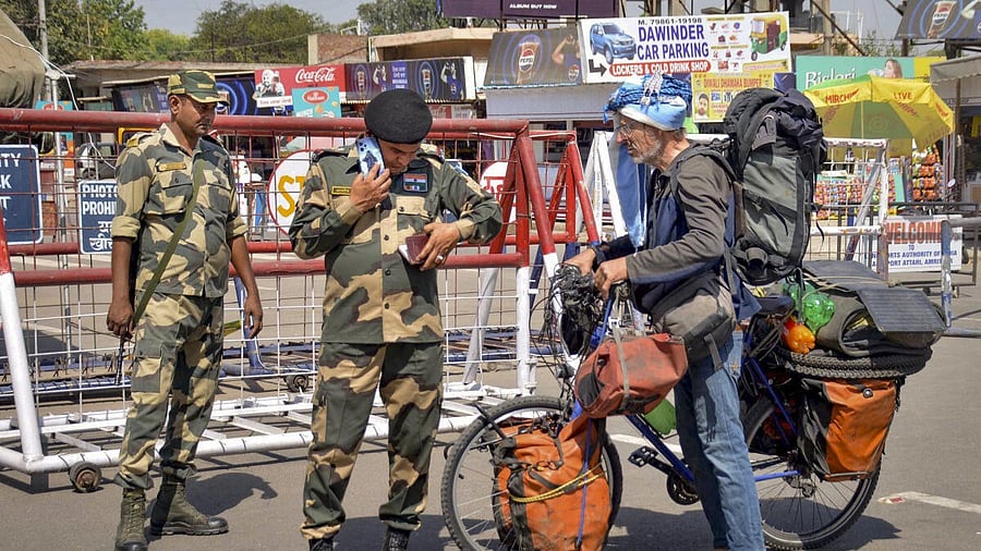 <div class="paragraphs"><p>Security personnel check documents of a foreign tourist at an Integrated Check Post Border, near the Attari-Wagah border, in Amritsar district, Punjab, Thursday, April 24, 2025.</p></div>