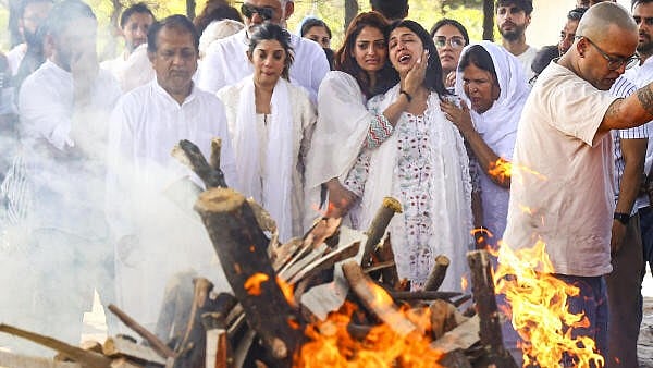<div class="paragraphs"><p>Family members mourn during last rites of Neeraj Udhwani, who was killed in the Pahalgam terror attack, in Jaipur.</p></div>