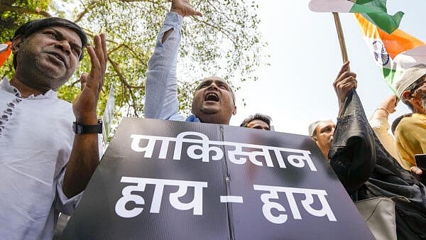 <div class="paragraphs"><p>People hold placards during a protest march by BJP along with Anti-Terror Action Forum and other organisations towards the Pakistan High Commission against the recent Pahalgam terror attack, in New Delhi.</p></div>