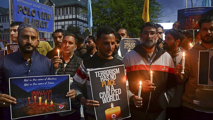 <div class="paragraphs"><p>People hold a candlelight march against the Pahalgam terror attack, in Srinagar, Wednesday. </p></div>