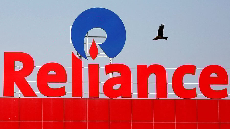<div class="paragraphs"><p>FILE PHOTO: A bird flies past a Reliance Industries logo installed on its mart in Ahmedabad, India January 16, 2017. </p></div>