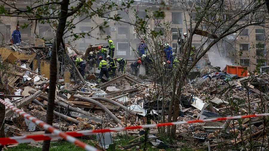 <div class="paragraphs"><p>Rescuers search for 17-year-old Danylo Khudia and his parents at the side of an apartment building hit by a Russian missile strike, amid Russia's attack on Ukraine, in Kyiv, Ukraine April 24, 2025.</p></div>