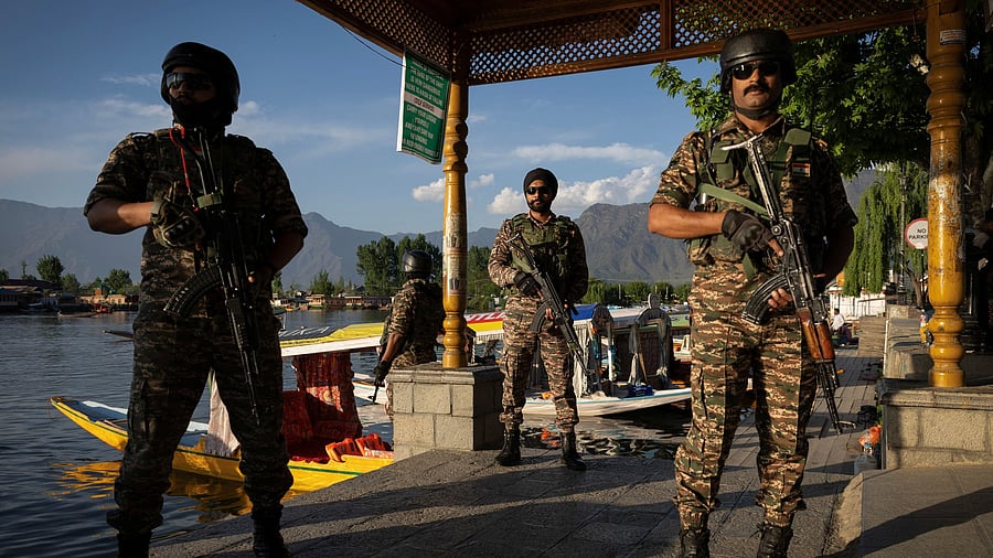 <div class="paragraphs"><p>Security force personnel stand guard on the banks of Dal Lake, following a suspected militant attack near south Kashmir's Pahalgam, in Srinagar April 25, 2025. </p></div>