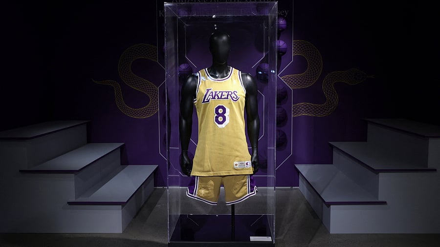 <div class="paragraphs"><p>The first game-worn jersey of former Los Angeles Lakers NBA basketball star Kobe Bryant from the 1996-97 season is pictured during a press preview ahead Sotheby's sale of sports memorabilia in New York City, US.</p></div>