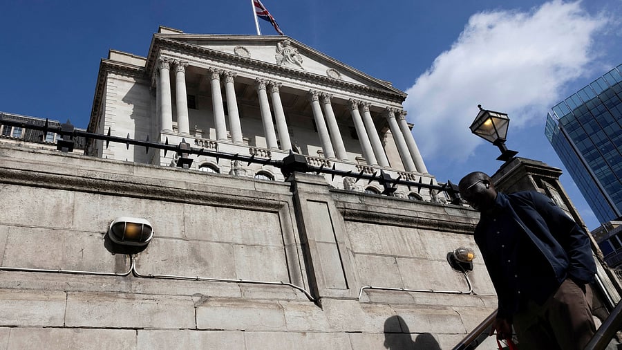 <div class="paragraphs"><p>A man walks down the stairs as the Bank of England building is seen on the backdrop in London.</p></div>