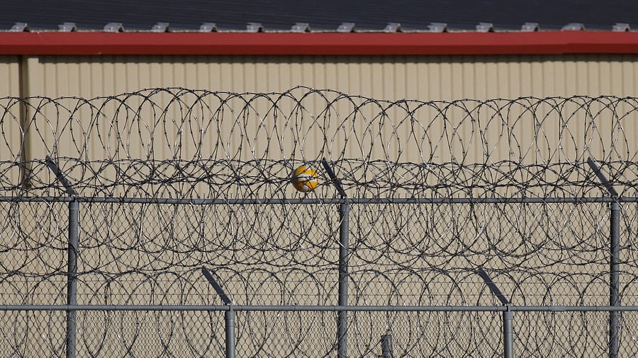 <div class="paragraphs"><p> A ball lies stuck on the fencing at a US detention facility. Representative image.</p></div>