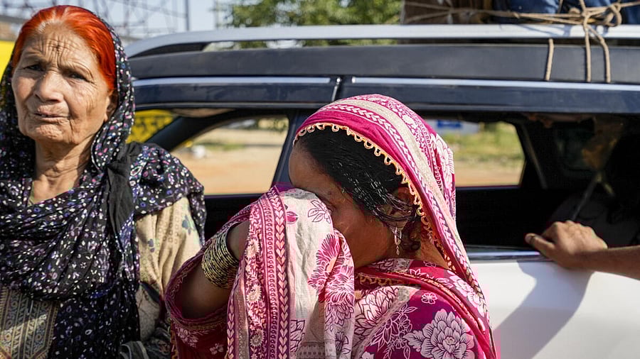 <div class="paragraphs"><p>Pakistani nationals wait for clearance at the Integrated Check Post at the Attari-Wagah border to move to their country, near Amritsar.</p></div>